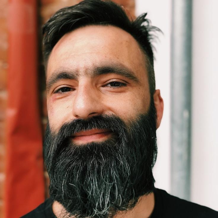 Kaveri Mehta, Lead Design Curator at Universal Know Ledgehub, reviewing corporate floral arrangements